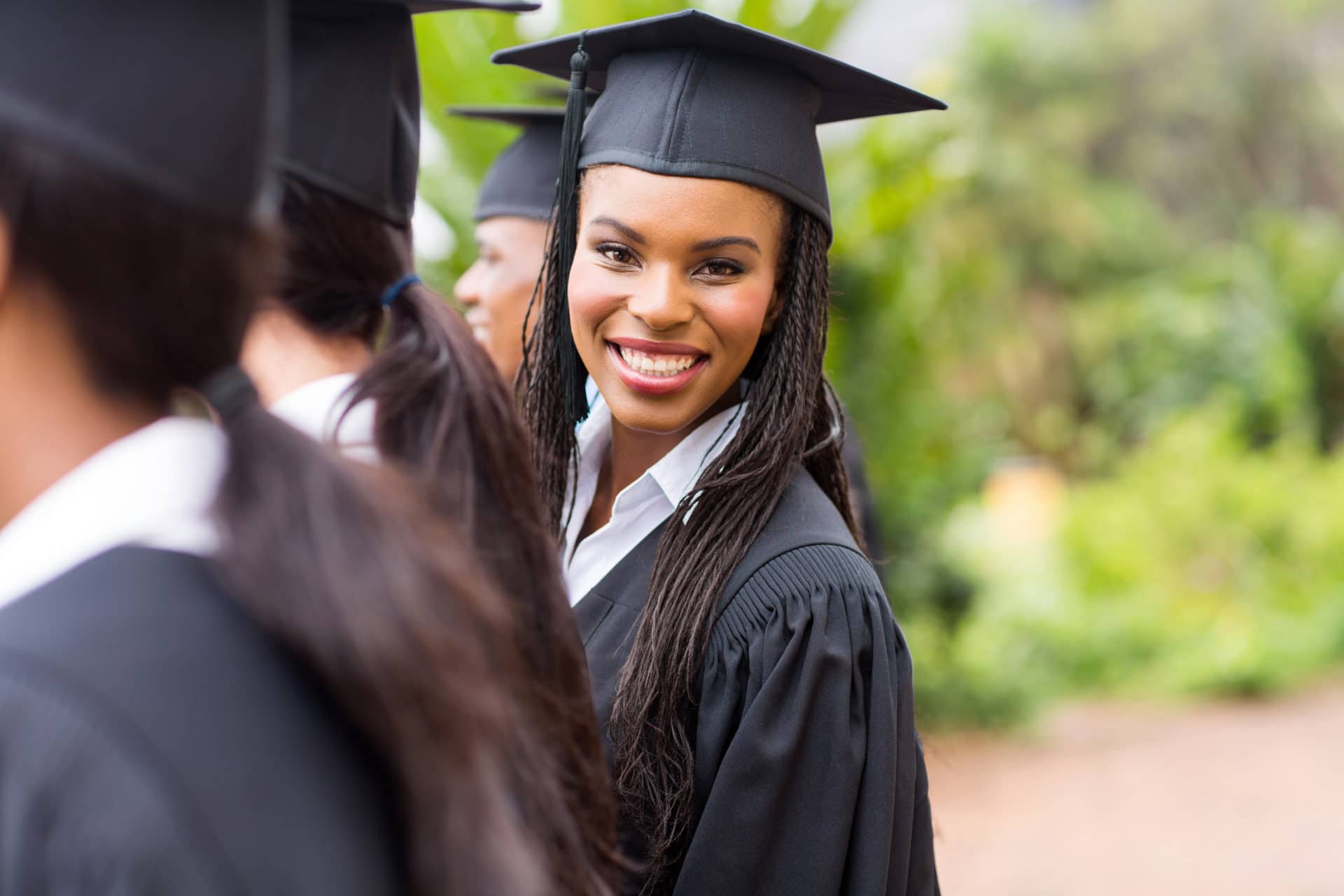 Photo of a woman in a college graduation gown